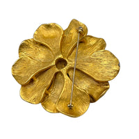 View showing the small spot of metal loss of Vintage Erwin Pearl green enamel flower brooch with gold-tone detailing displayed on white background.