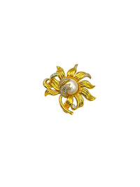 Vintage Joan Rivers gold-tone sunflower brooch with pearl center and rhinestone accents.
