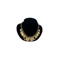 Vintage gold heart charm necklace with textured hearts and link chain displayed on black velvet bust.