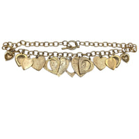 Back view of Vintage gold heart charm necklace with textured hearts and link chain displayed on white background.