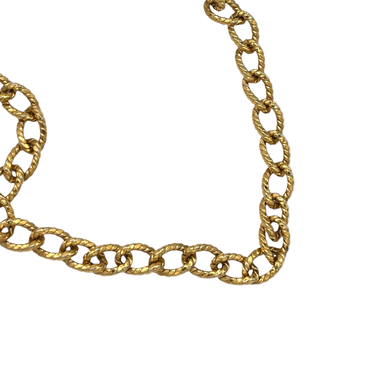 Close up view of links Erwin Pearl textured gold curb link vintage chain necklace displayed on white background.