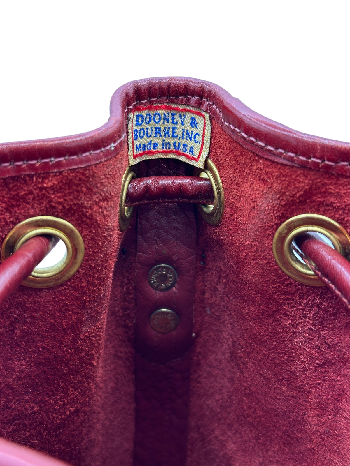 Dooney & Bourke All Weather Leather (AWL) Small Burgundy Red Drawstring Bucket Crossbody Handbag USA