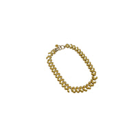 Anne Klein II vintage gold link statement necklace on display on white background.