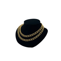Side view of Erwin Pearl textured gold curb link vintage chain necklace double wrapped displayed black bust.
