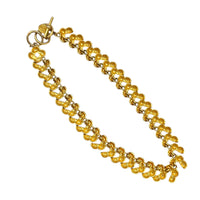 Back view of Anne Klein II vintage gold link statement necklace on display on white background.