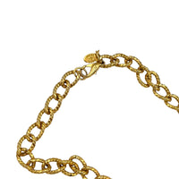 Close up view of clasp and hang tag of Erwin Pearl textured gold curb link vintage chain necklace displayed on white background.