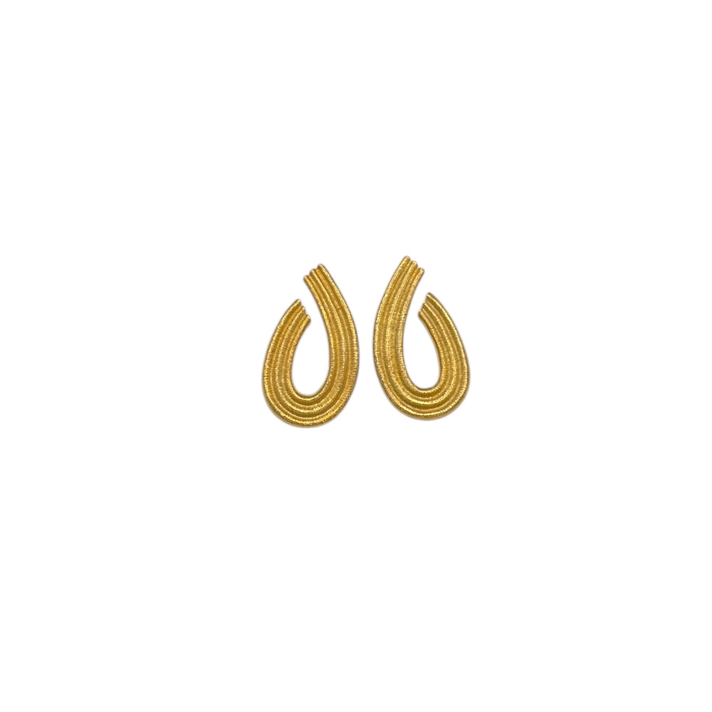 Vintage Givenchy gold teardrop dangle earrings with textured finish displayed on white background.
