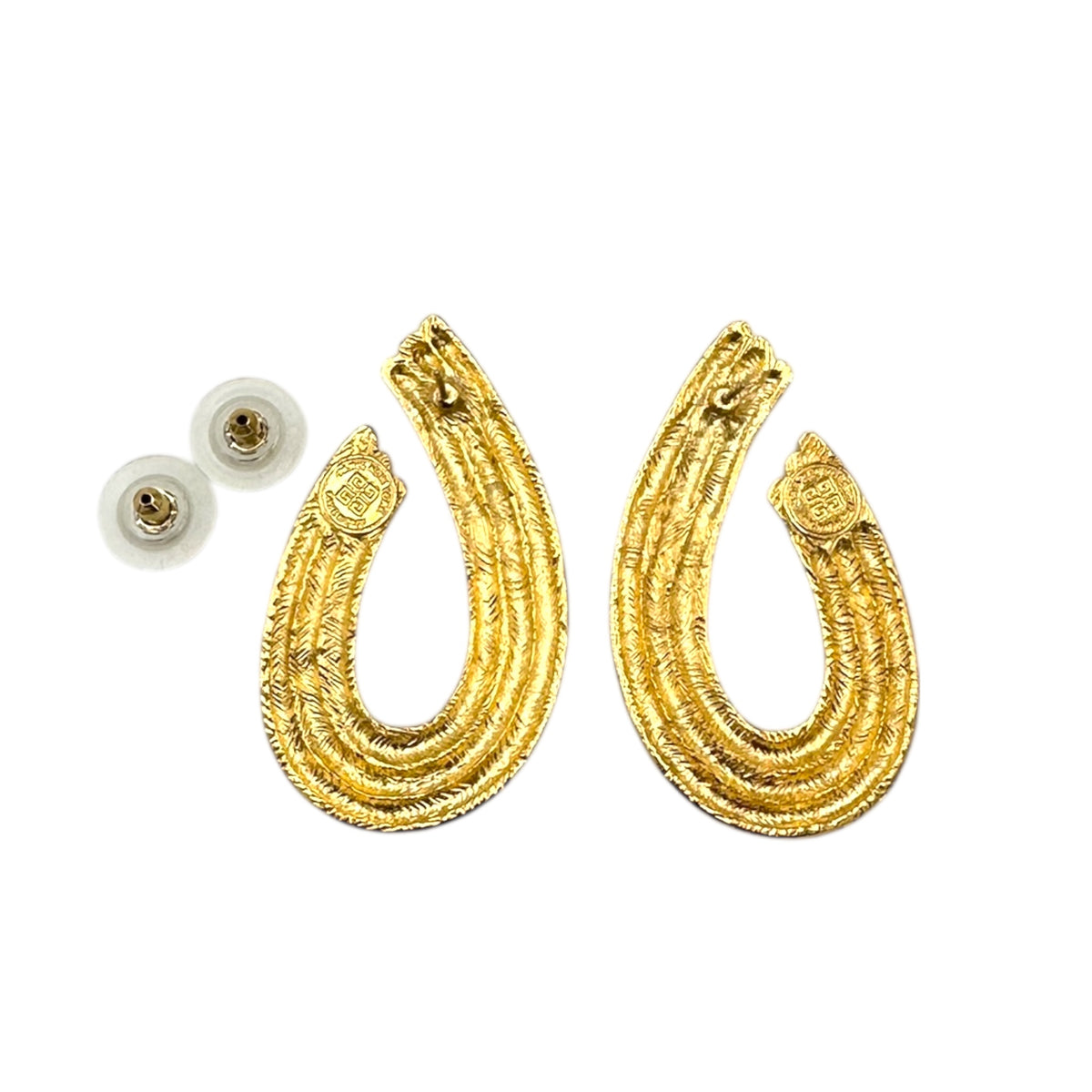 Back view of Vintage Givenchy gold teardrop dangle earrings with textured finish displayed on white background.