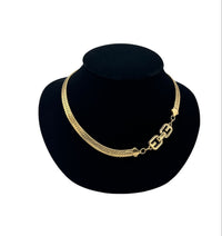 Close up view of Givenchy Gold Herringbone Chain Vintage Necklace on black bust.