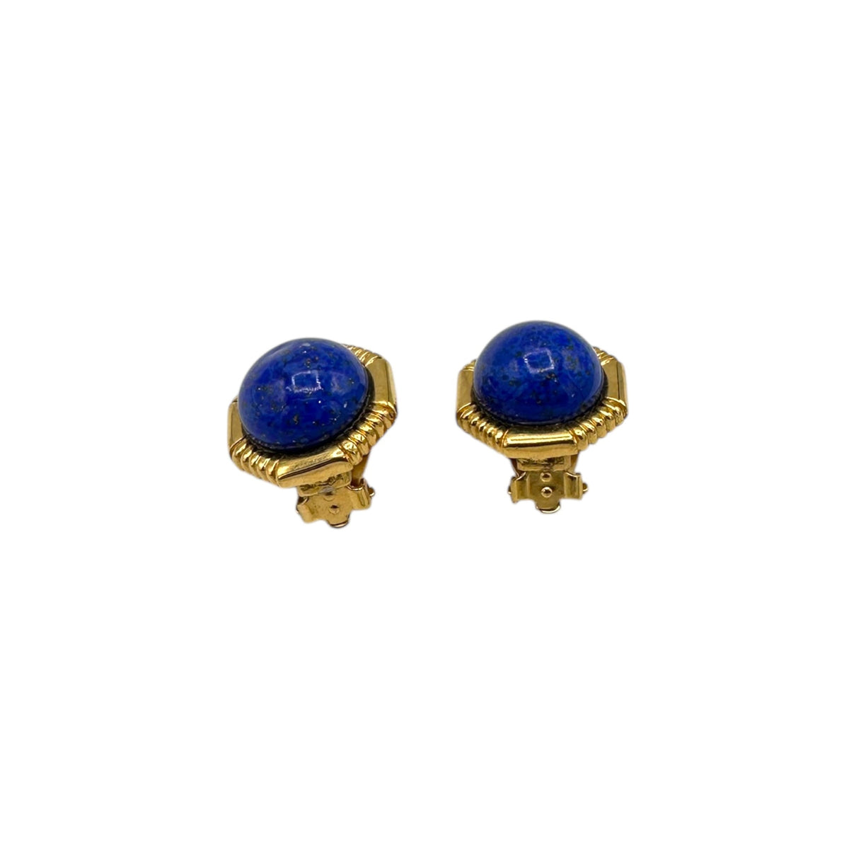 Bottom view of Vintage Ciner gold clip-on earrings with round blue lapis glass cabochons displayed on white background.
