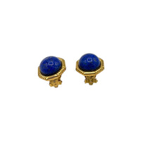 Bottom view of Vintage Ciner gold clip-on earrings with round blue lapis glass cabochons displayed on white background.