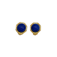 Vintage Ciner gold clip-on earrings with round blue lapis glass cabochons displayed on white background.