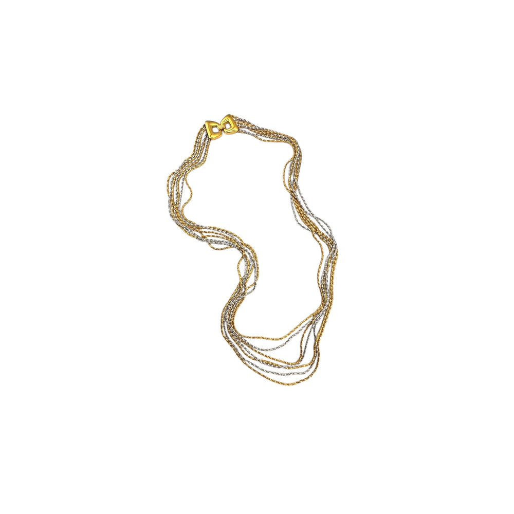 Crown Trifari signed vintage gold and silver multi-strand chain necklace on white background.