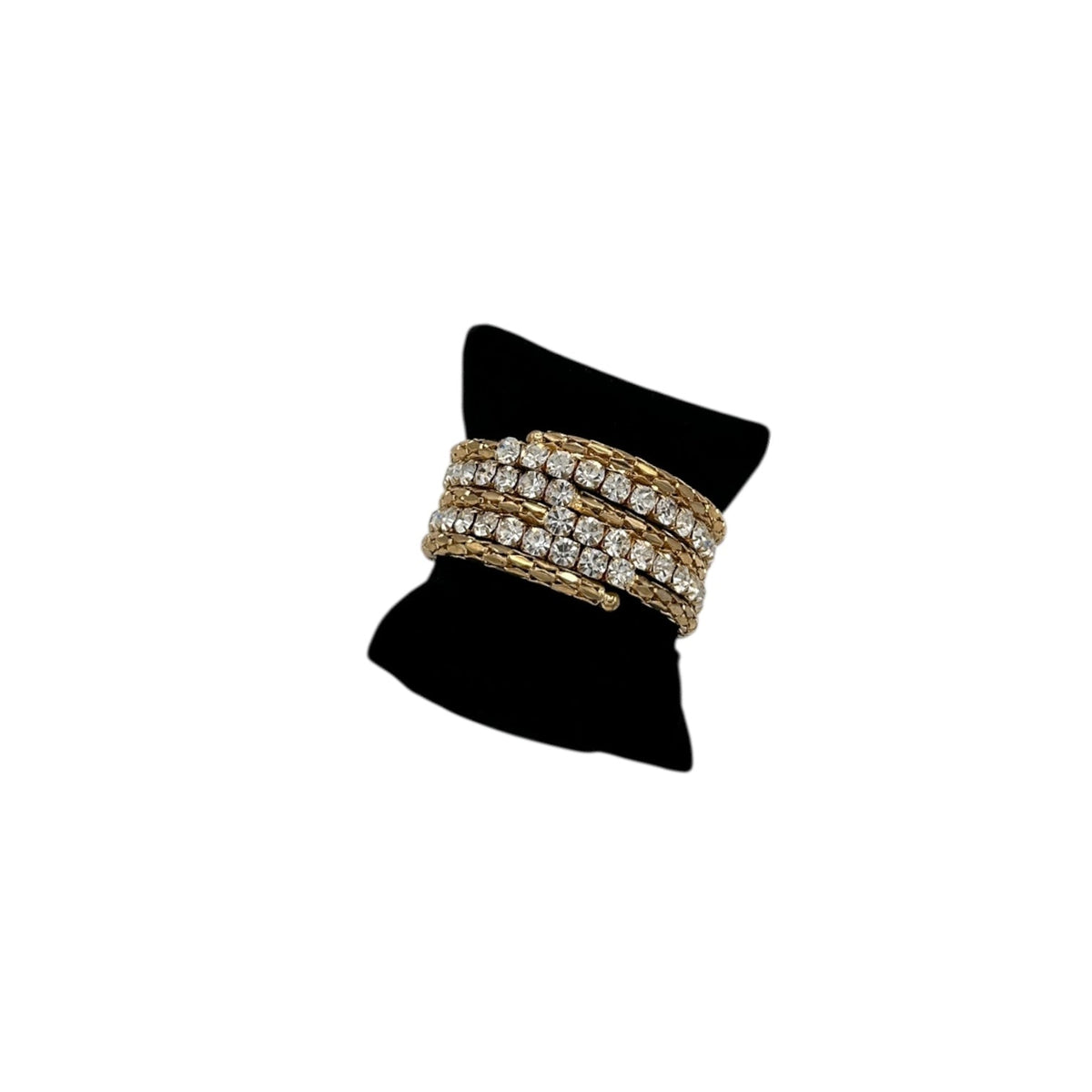 Vintage 80s 90s Mesh Coil Bracelet with Large Clear Rhinestones on a black stand against a white background