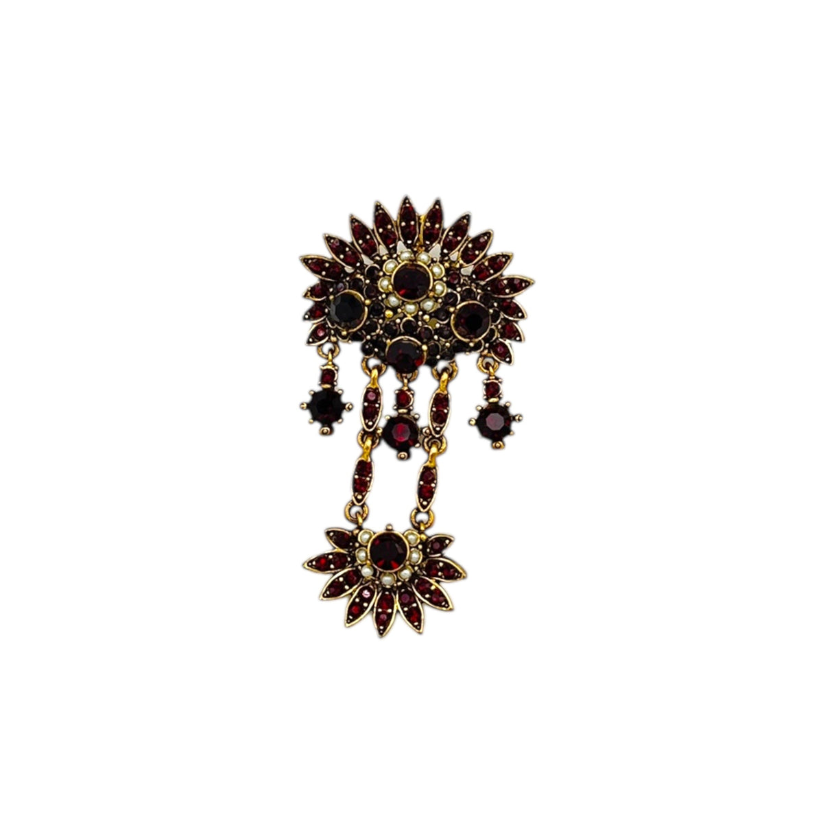 Hollycraft Victorian Revival brooch with deep red rhinestones, faux pearls, and cascading gold-tone dangles – vintage statement jewelry shown on white background.