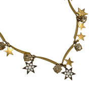 J. Crew vintage antiqued gold star charm necklace with rhinestone accents displayed on white background.