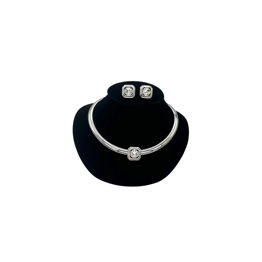 Vintage Joan Rivers silver omega necklace and matching clear rhinestone clip-on earring set on black bust.