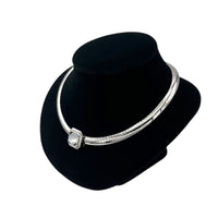 Side view of Vintage Joan Rivers silver omega necklace on black bust.