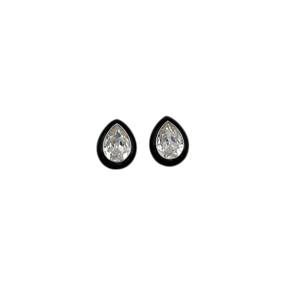 Vintage Kenneth Jay Lane clear teardrop rhinestone clip-on earrings with black enamel border displayed on white background.