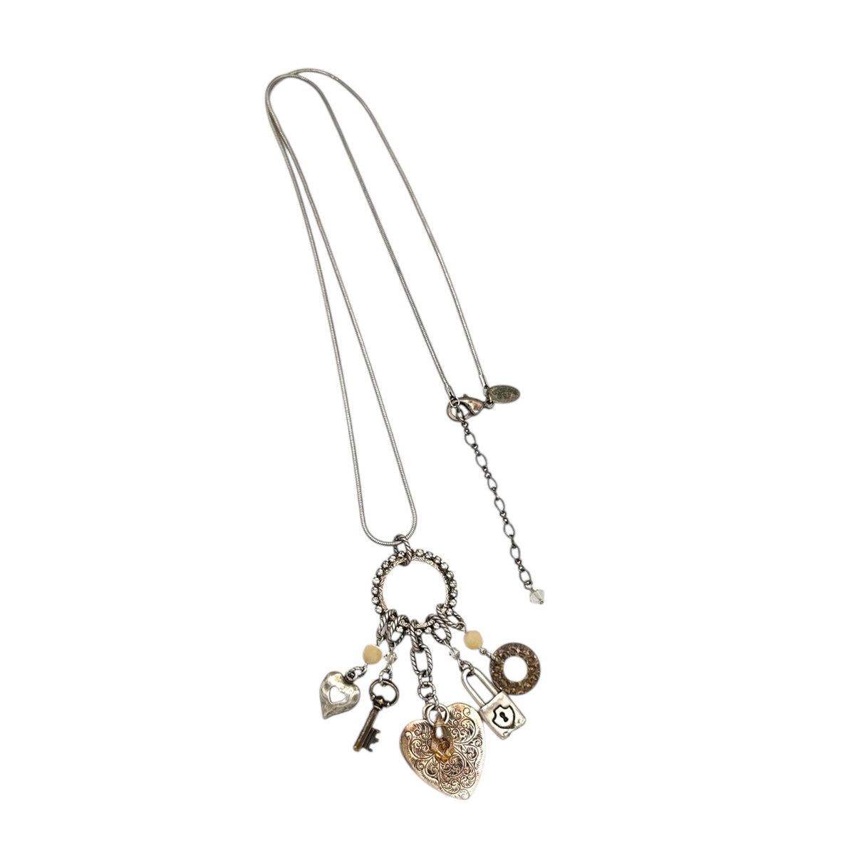 Vintage Liz Palacios San Francisco silver charm necklace with heart and key pendants displayed on white background.