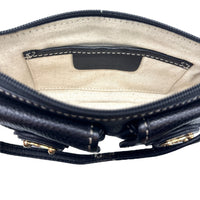 Interior one view of Vintage Michael Kors black pebbled leather Roadie bag with gold hardware and dual front pockets displayed on white background.