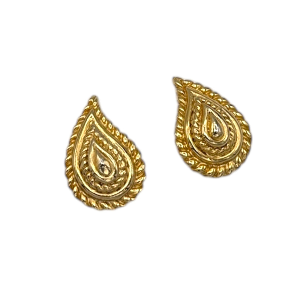 Close up view of Vintage Mimi di N gold paisley clip-on earrings with textured teardrop design displayed on white background.