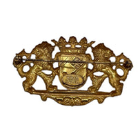 Back view of Miriam Haskell gold lion crest vintage brooch with crown and coat of arms design on white background.