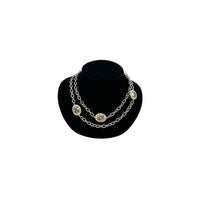 Vintage mixed metal long cable chain necklace with gold bezel-set oval crystals displayed on black velvet bust.