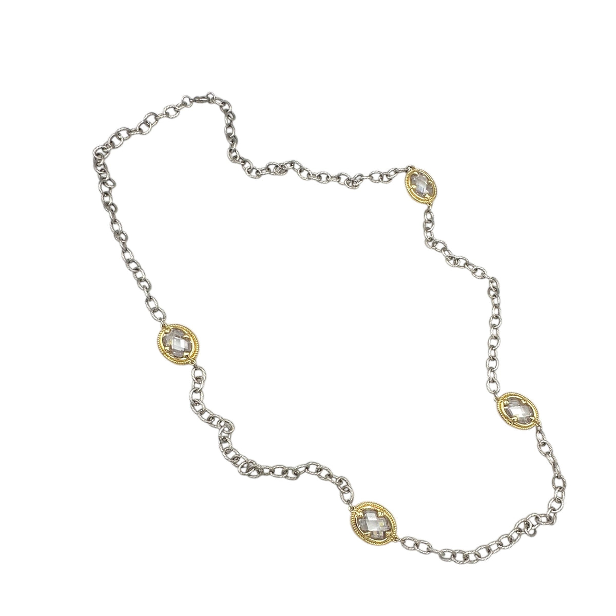 Close up view of Vintage mixed metal long cable chain necklace with gold bezel-set oval crystals displayed on white background.