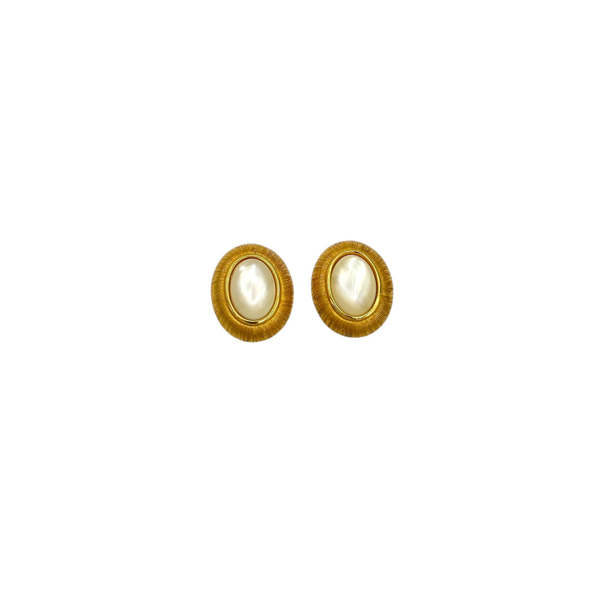 Monet vintage gold oval clip-on earrings with opalescent cabochon centers and textured gold frame on white background.