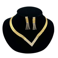 Close up view of Vintage Park Lane gold chevron rhinestone necklace and matching pierced earrings displayed on black velvet bust.