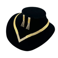 Side view of Vintage Park Lane gold chevron rhinestone necklace and matching pierced earrings displayed on black velvet bust.