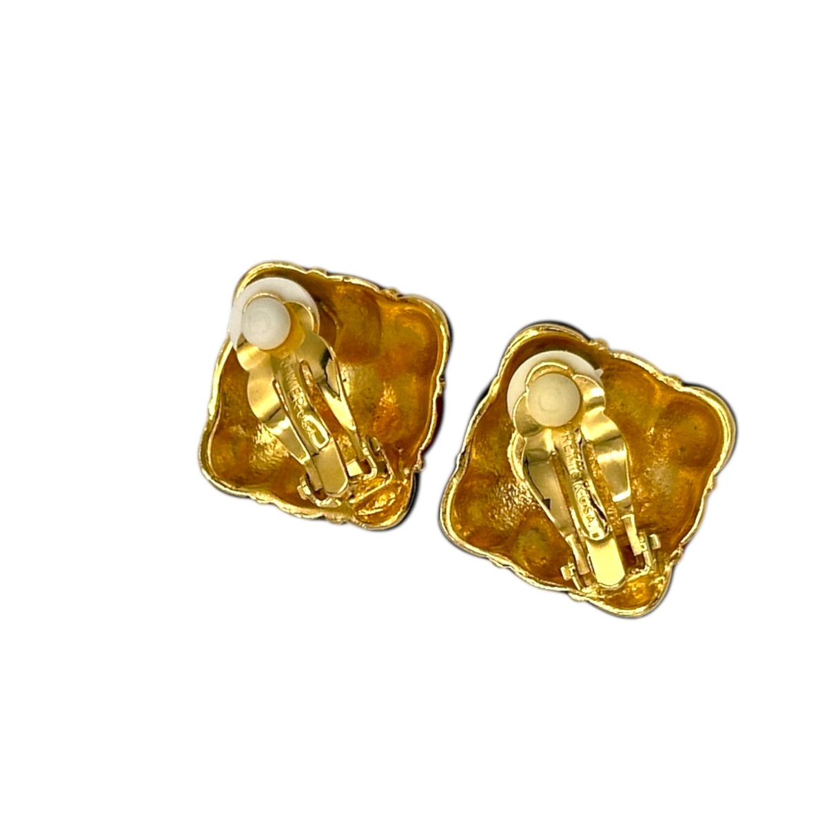 Back view of Vintage Premier Design jewel-tone enamel clip-on earrings with gold grid design in red, green, and amber colors – 1980s statement jewelry shown on white background.