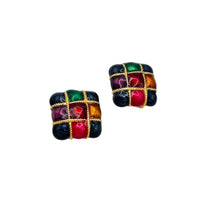 Side view of Vintage Premier Design jewel-tone enamel clip-on earrings with gold grid design in red, green, and amber colors – 1980s statement jewelry shown on white background.