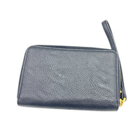 Back view of Vintage Ralph Lauren RLL black pebbled leather wristlet wallet with gold logo plaque displayed on white background.