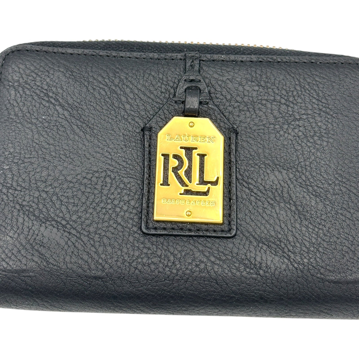Close up view of Vintage Ralph Lauren RLL black pebbled leather wristlet wallet with gold logo plaque displayed on white background.