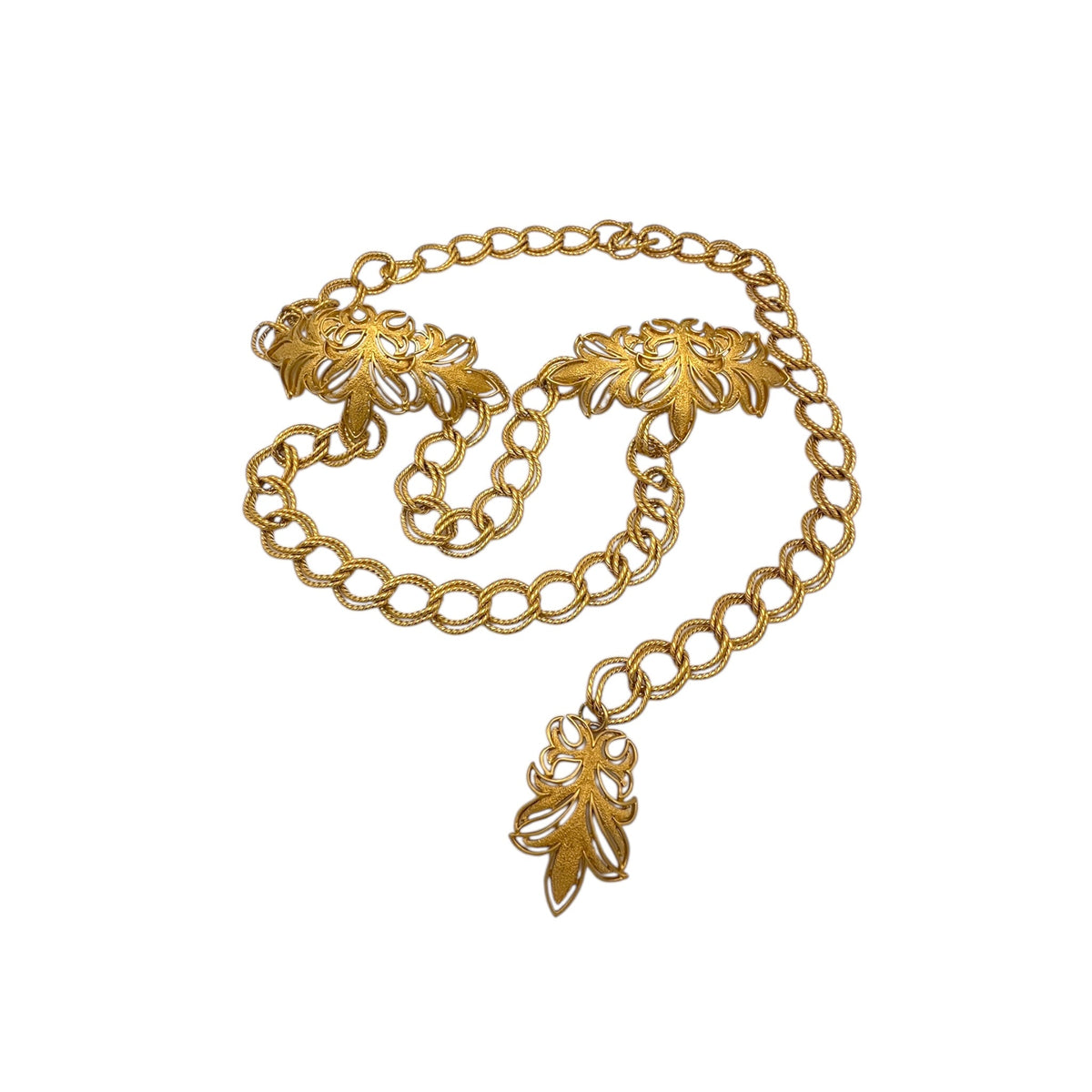 Vintage St. John matte gold layered bib belt with ornate leaf accents and curb chain design displayed on white background.