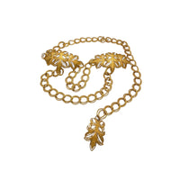 Vintage St. John matte gold layered bib belt with ornate leaf accents and curb chain design displayed on white background.