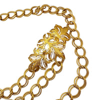 Right side view of Vintage St. John matte gold layered bib belt with ornate leaf accents and curb chain design displayed on white background.