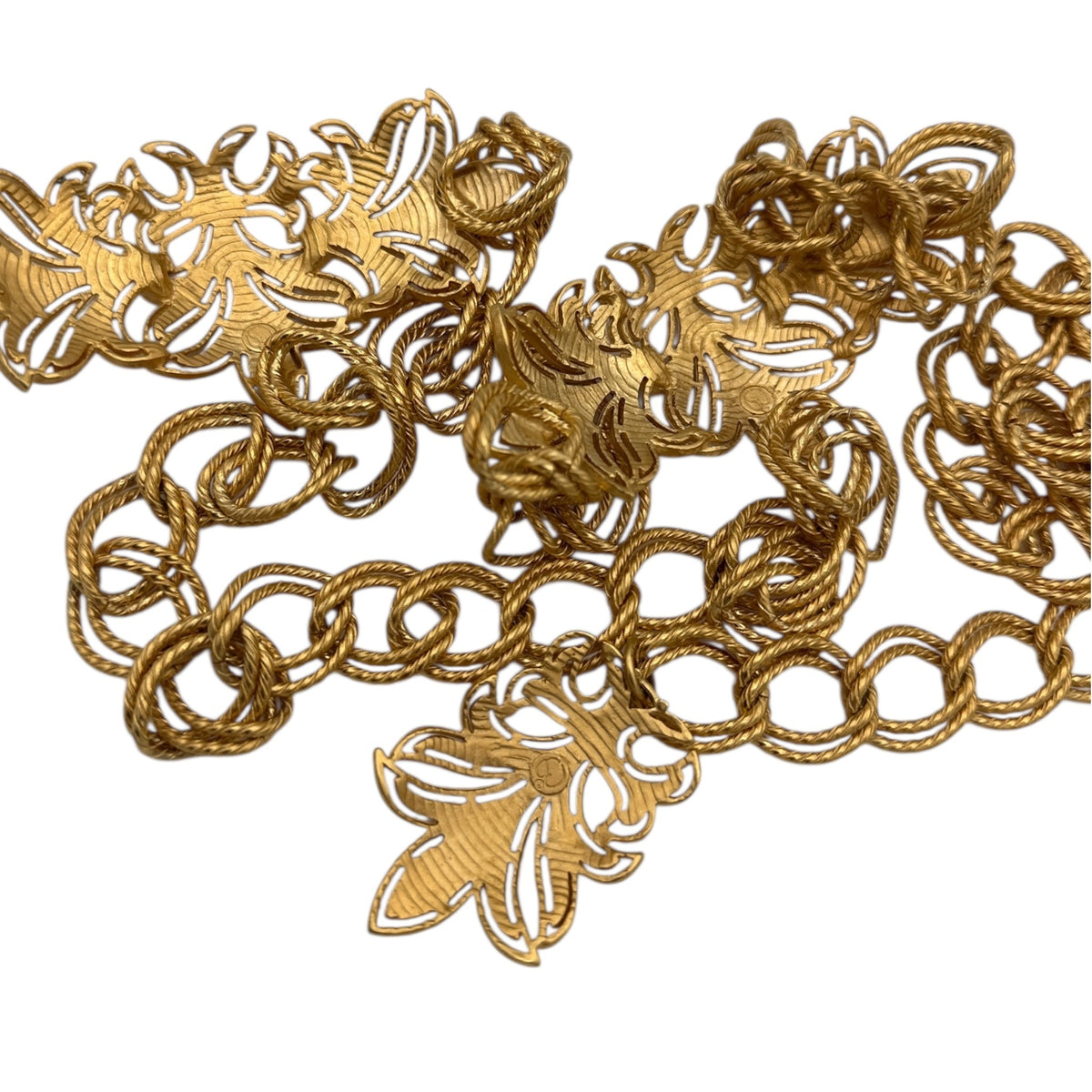 Back view of Vintage St. John matte gold layered bib belt with ornate leaf accents and curb chain design displayed on white background.