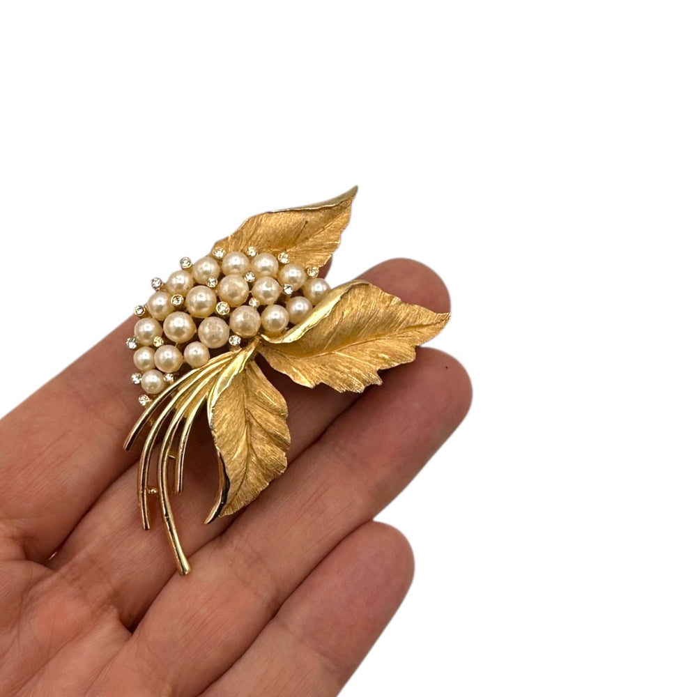 Brooches & PinsVintage 1960s Trifari Gold Floral Brooch with Faux Pearls and Rhinestones
