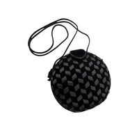 Front view of Vintage black round velvet and satin weave small crossbody handbag with cord strap displayed on white background.