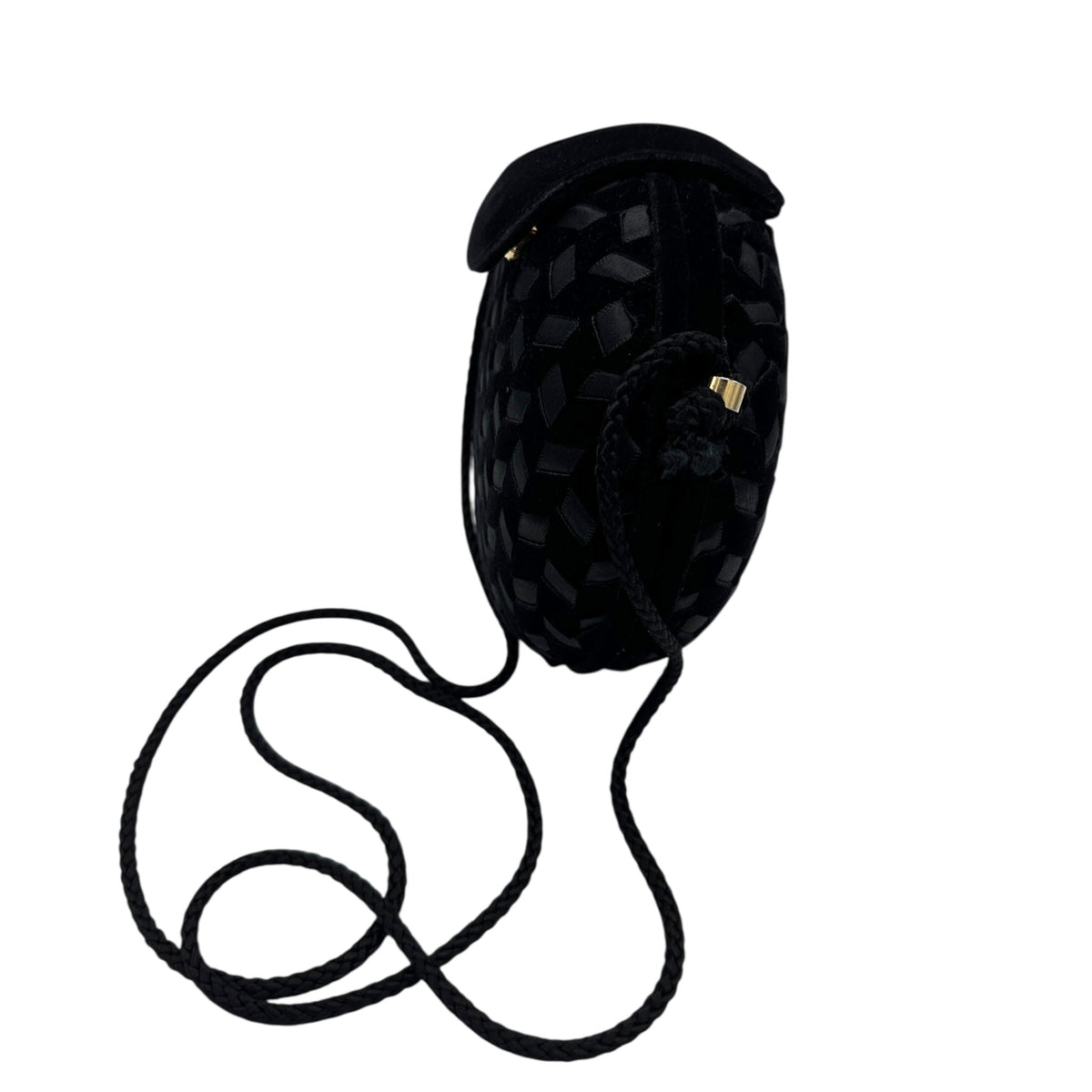 Side view of Vintage black round velvet and satin weave small crossbody handbag with cord strap displayed on white background.