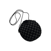 Vintage black round velvet and satin weave small crossbody handbag with cord strap displayed on white background.