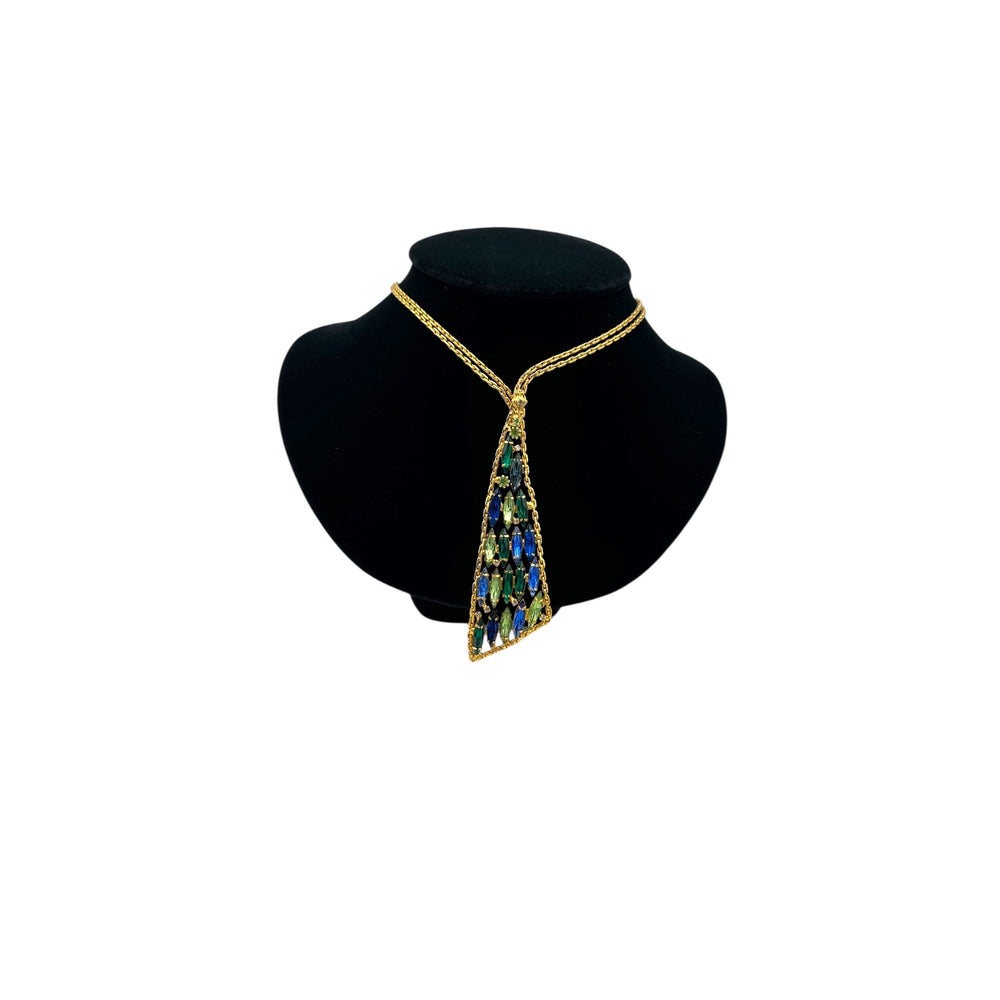 Vintage gold chain tie necklace with blue and green marquise rhinestone pendant on black bust.