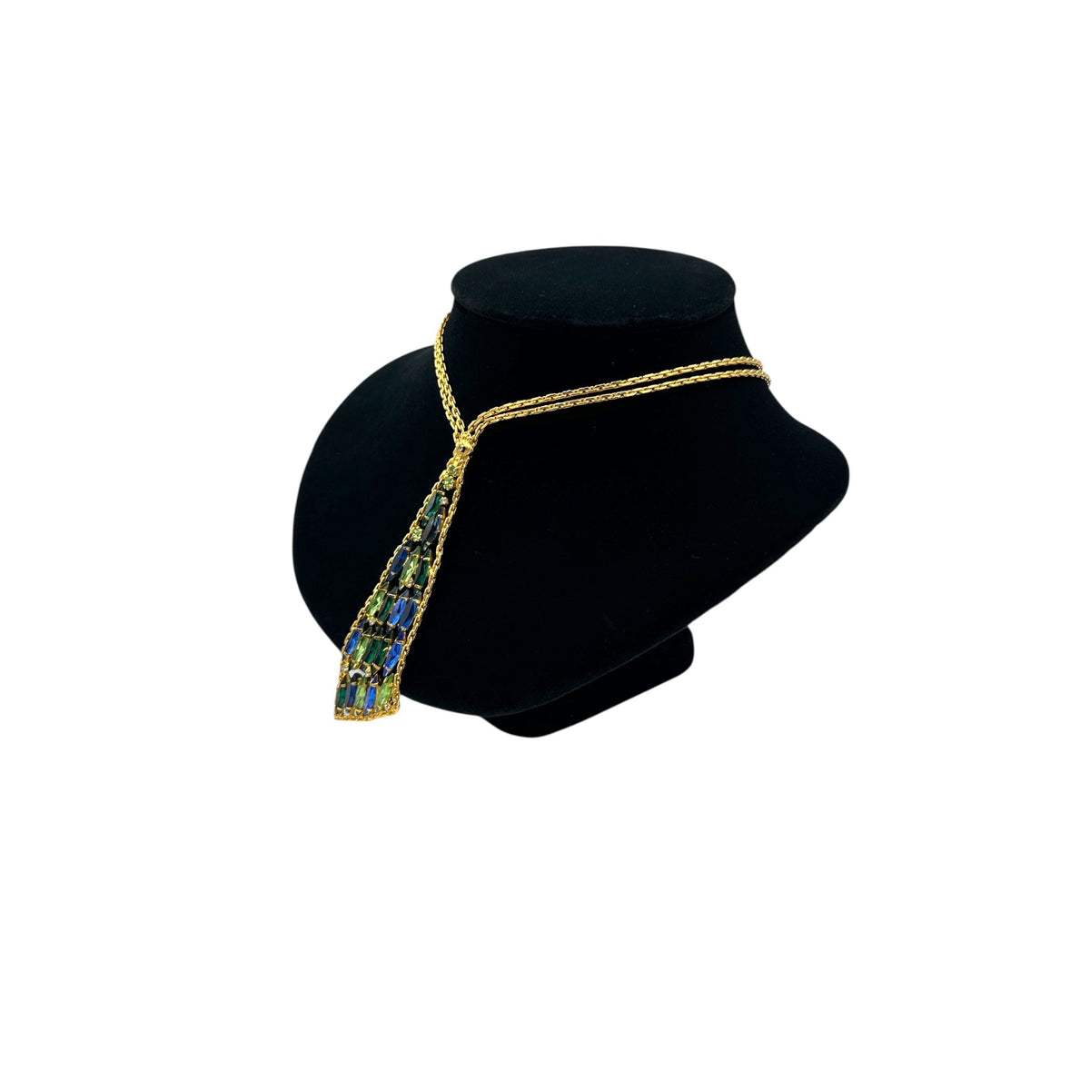 Side view of Vintage gold chain tie necklace with blue and green marquise rhinestone pendant on black bust.