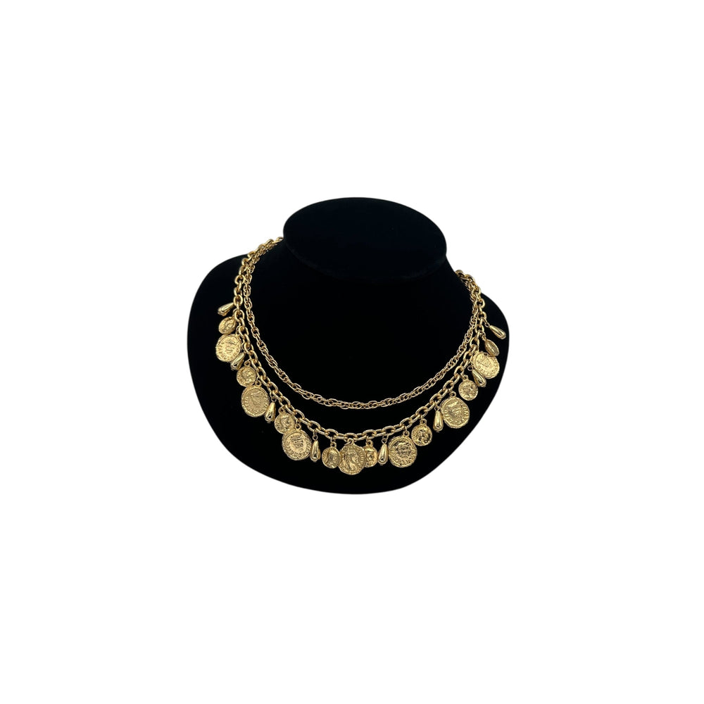Vintage gold layered Roman coin charm necklace with medallions and teardrop accents displayed on black velvet bust.