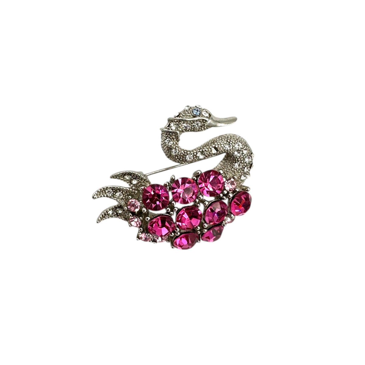 Side view of Vintage silver swan brooch with large round pink rhinestones on white background.