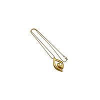 Vintage Trifari gold modernist pendant necklace on long snake chain on white background.