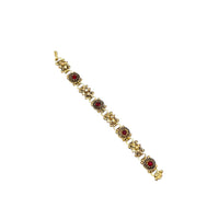 Vintage Victorian Revival gold tone book chain bracelet with ruby red glass cabochon centerpiece displayed on white background.